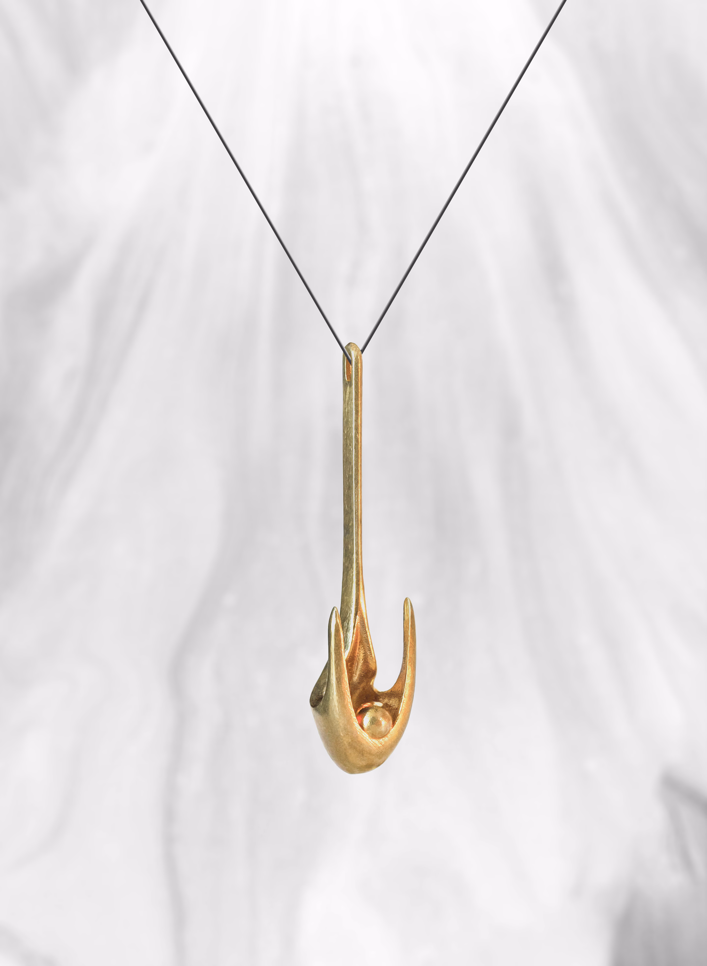 Icarus hanging on a fine cord against white marble